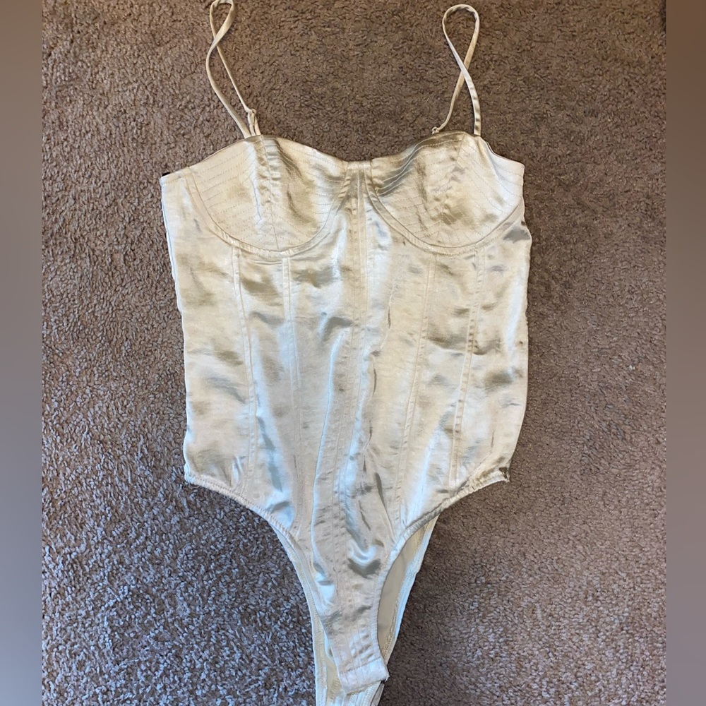 White shiny body suit